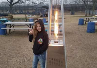 Young girl staying warm at Cousins Paintball