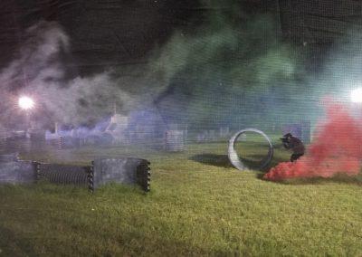 Paintball player lining up his next shot during the Smoke Scenario at Cousins Paintball.